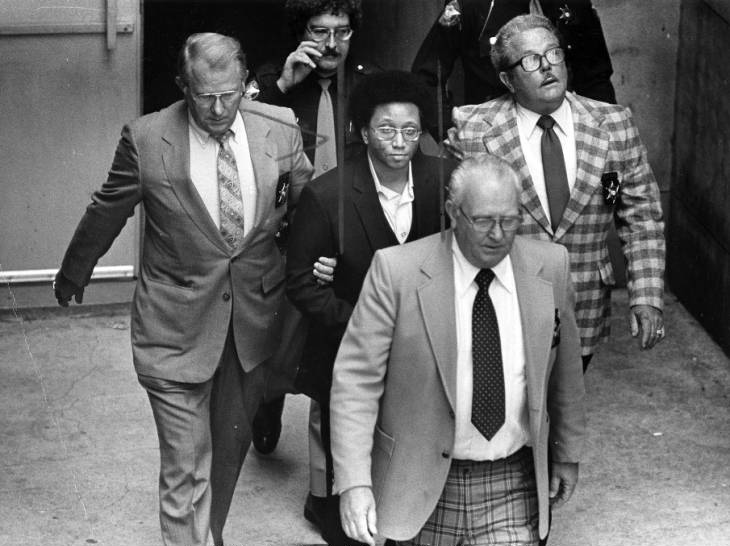 Black and white photograph of Wayne Williams being escorted back to jail