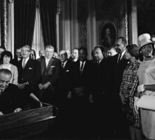 Johnson Signs Voting Rights Act