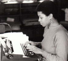 Black and white photo of Shay Youngblood at typewriter