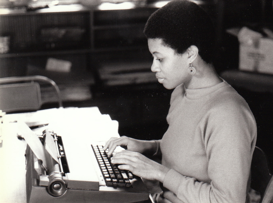 Black and white photo of Shay Youngblood at typewriter