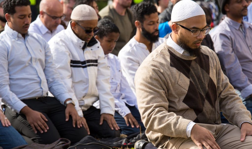 A group of Muslims pray in protest to immigration restrictions in Atlanta.