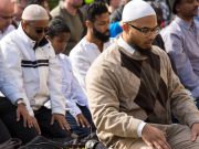 A group of Muslims pray in protest to immigration restrictions in Atlanta.