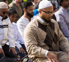 A group of Muslims pray in protest to immigration restrictions in Atlanta.