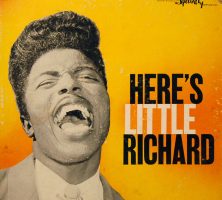 An album cover with a yellow background and a young Little Richard in black-and-white, singing.