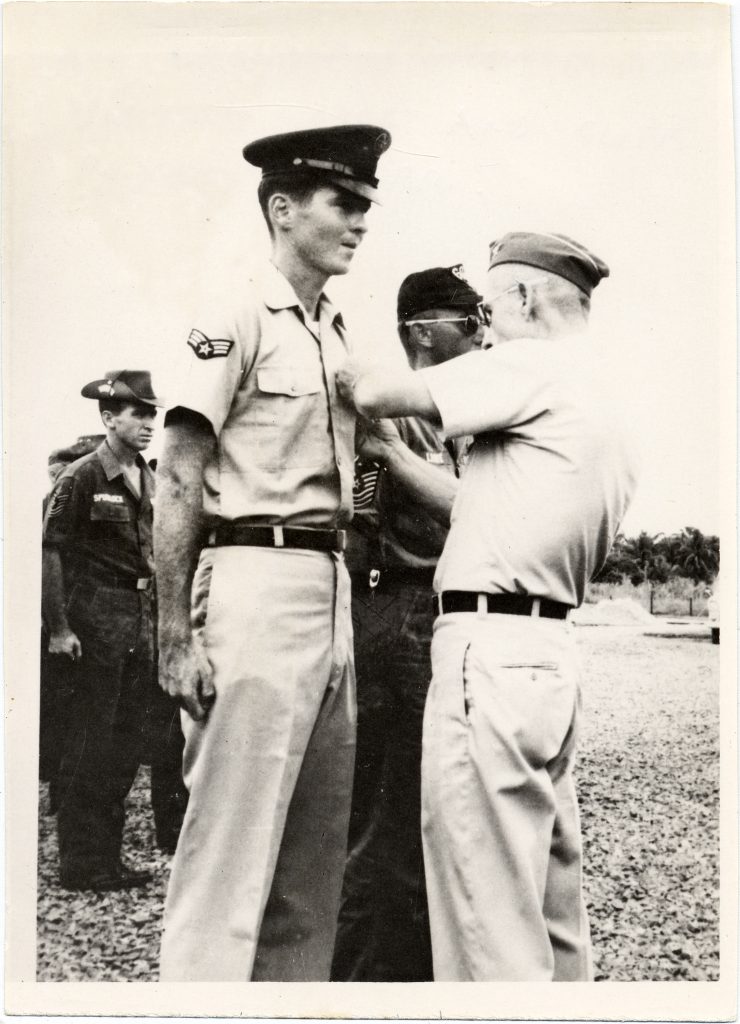 Black and white photograph of Leonard Matlovich receiving a Bronze Star in Vietnam.