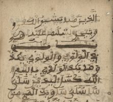 Color image of a page from the Bilali Manuscript composed by Bilali Mohammed, an enslaved African on Sapelo Island. Arabic script fills the page and the book's spine is visible on the righthand side.