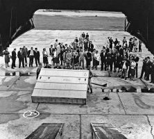 A group of people watch the unloading of a crate containing a painting by Jasper Johns at the XXXII Venice Biennale in Venice, Italy.