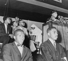 Elijah Muhammad addresses followers including Muhammad Ali.